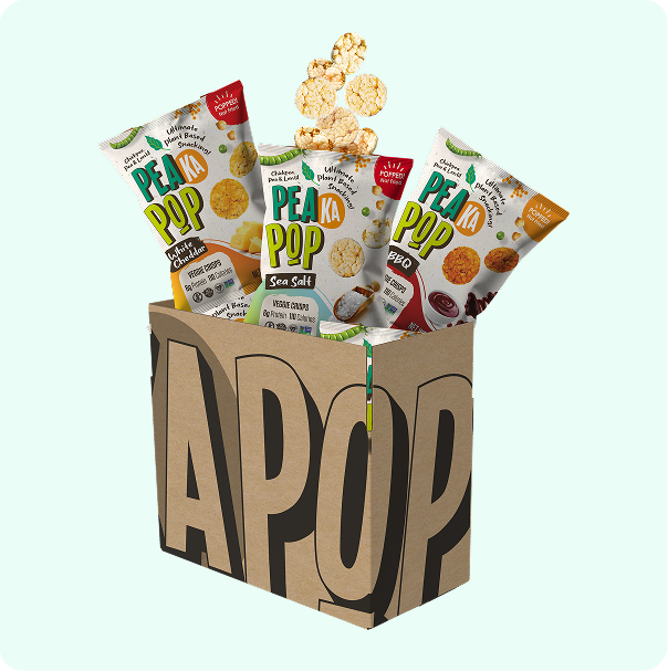 Box of Pea Pop snack packages with snacks spilling out on a light blue background